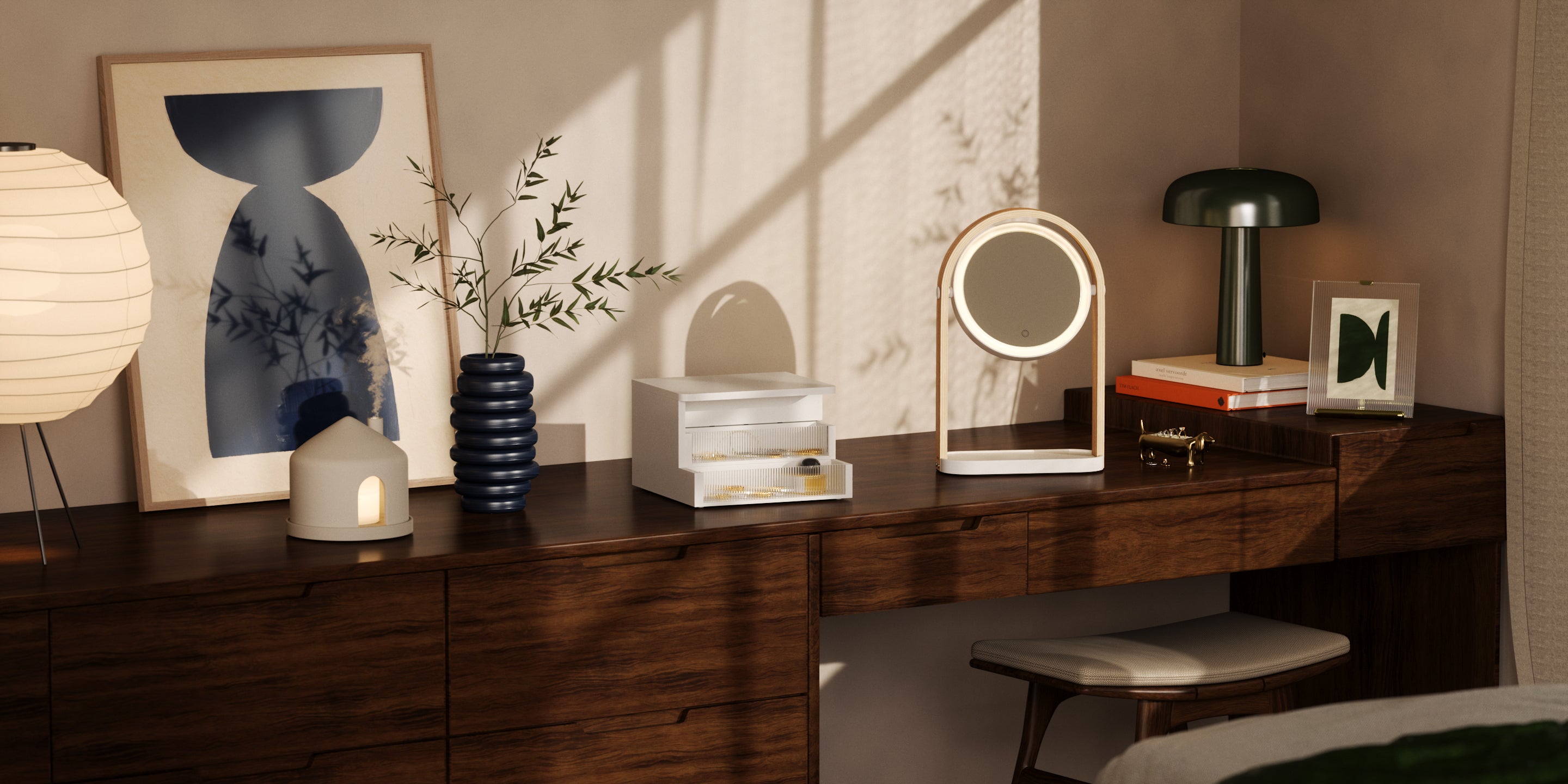 Umbra bedroom vanity styled with a lit vanity mirror, ceramic diffuser, jewellery box and framed art on a walnut dresser